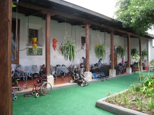 (a photo from Google) Children in wheelchairs, under nets, to keep flies out of their mouths